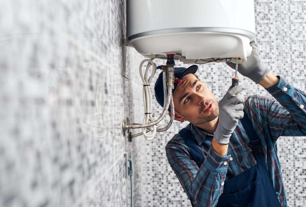 Whitestone Heating and Cooling specialist is repairing boiler in a house Coquitlam
