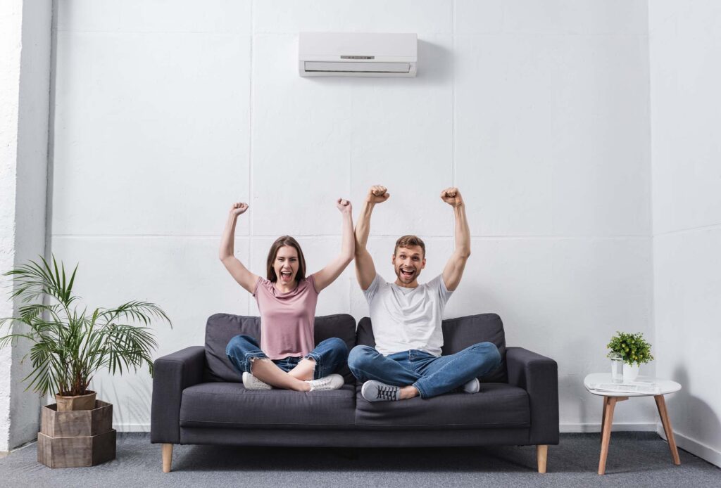 Couple happy in Home with working AC