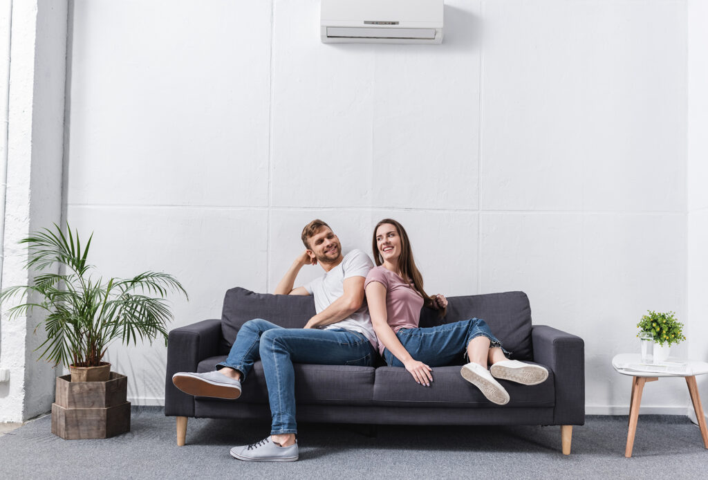 man and woman happy in Home with working AC